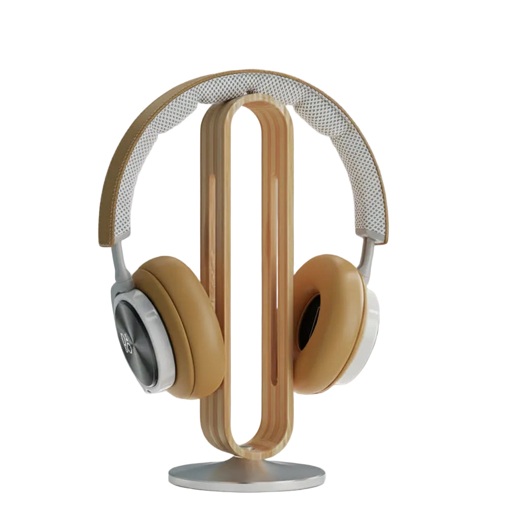 Wooden headphone stand holding a pair of headphones on a light gray background