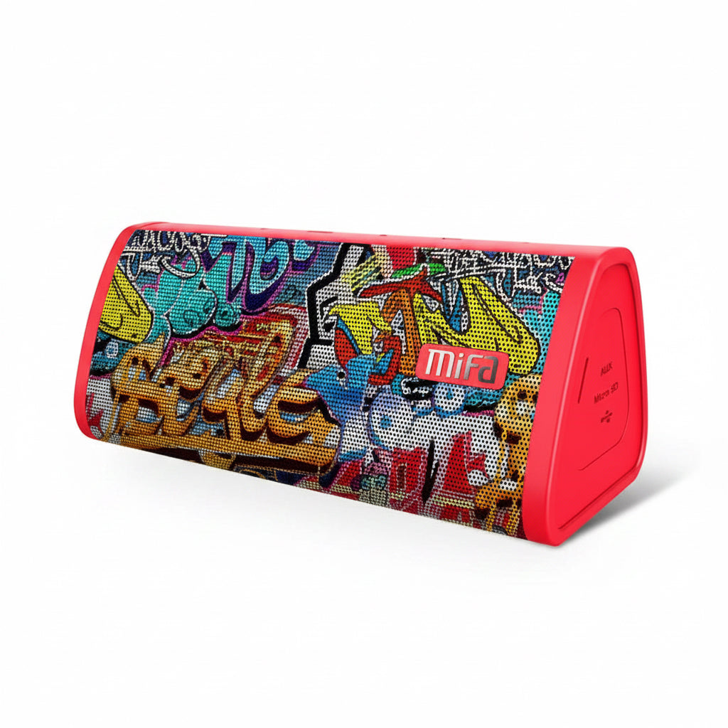 Colorful graffiti-style Bluetooth speaker with 'mifa' branding on a table outdoors.